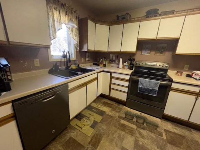 kitchen featuring dishwashing machine, stainless steel electric stove, light countertops, and a sink