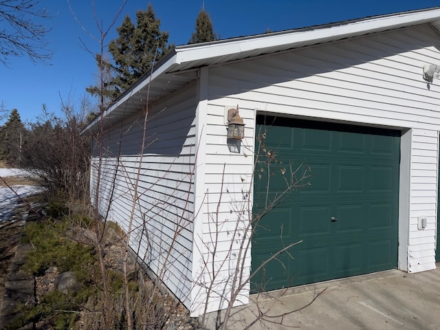 view of home's exterior featuring a garage and an outdoor structure