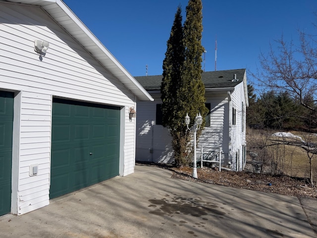 exterior space with concrete driveway