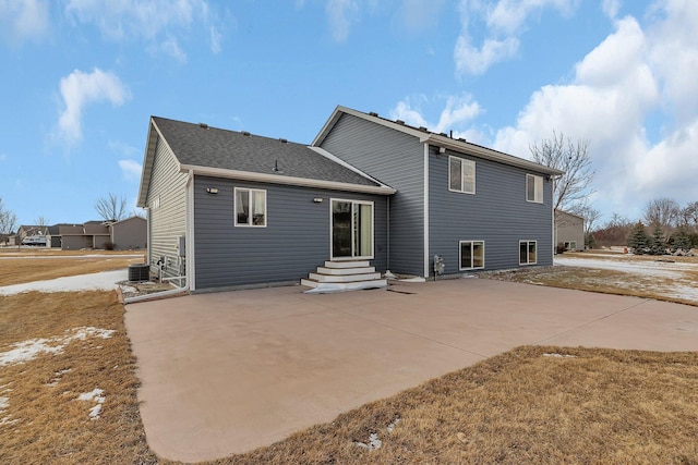 back of house with a patio area and central AC