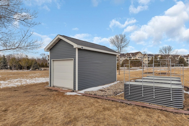 view of outdoor structure featuring an outbuilding and central AC unit