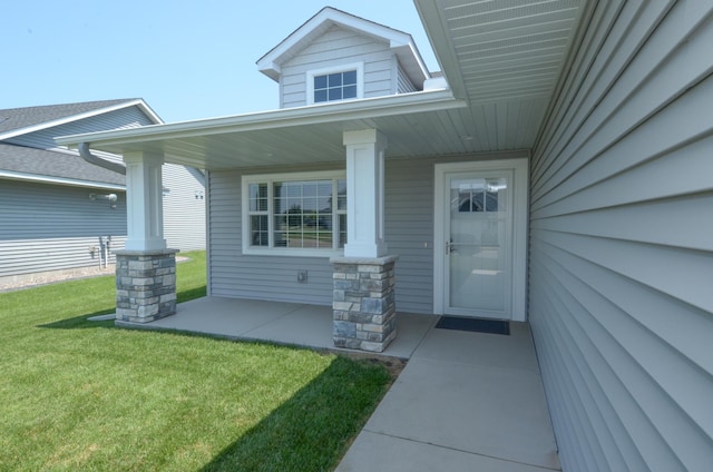 324 Bluebird Dr NW, Isanti, MN 55040 - view of exterior entry featuring a yard and a porch