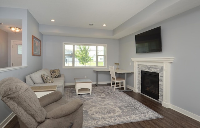 324 Bluebird Dr NW, Isanti, MN 55040 - living area with dark wood-type flooring, a stone fireplace, and recessed lighting