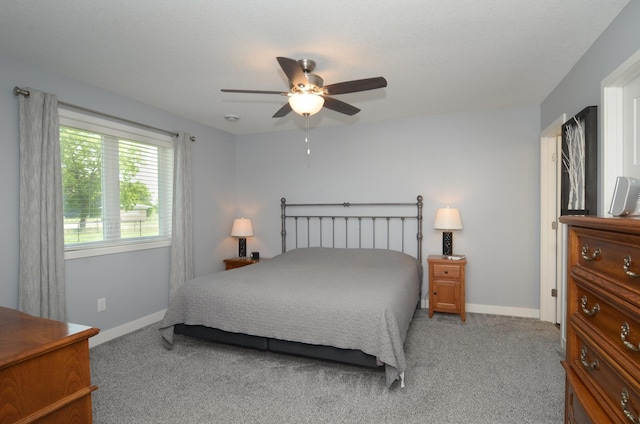 324 Bluebird Dr NW, Isanti, MN 55040 - bedroom with carpet floors and ceiling fan