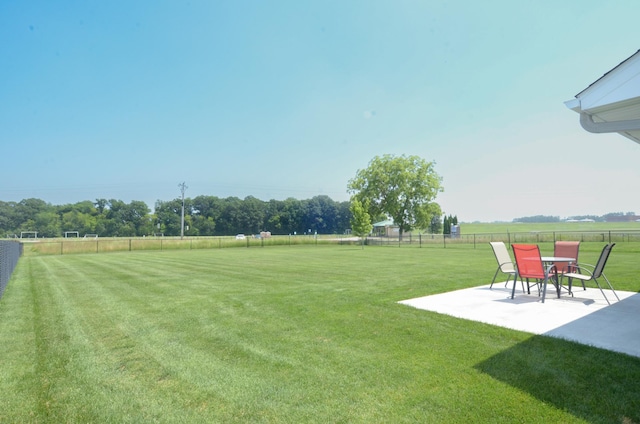 324 Bluebird Dr NW, Isanti, MN 55040 - fenced backyard featuring a patio area