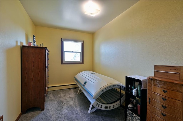 bedroom featuring a baseboard radiator and carpet flooring