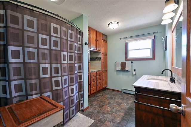 full bathroom featuring baseboards, a shower with curtain, baseboard heating, a textured ceiling, and vanity