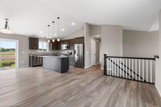 1003 Misty Meadow Blvd, Buffalo, MN 55313 - kitchen featuring appliances with stainless steel finishes, dark brown cabinets, a center island, baseboards, and recessed lighting