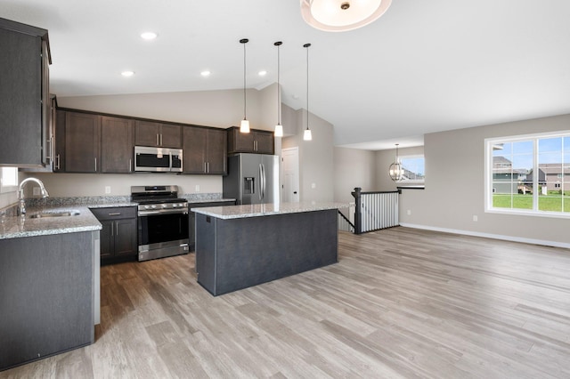 1003 Misty Meadow Blvd, Buffalo, MN 55313 - kitchen featuring stainless steel appliances, a sink, dark brown cabinets, a center island, and light wood finished floors