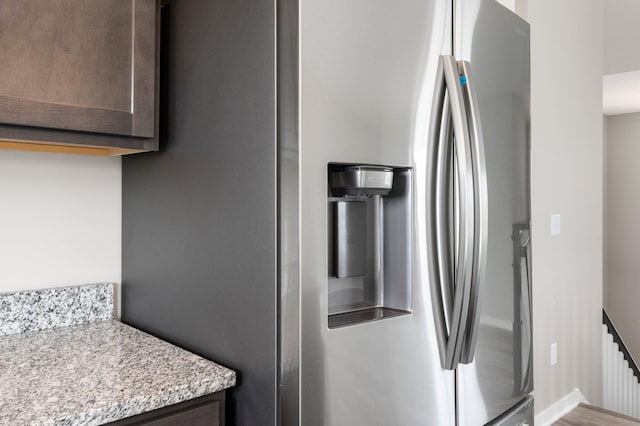 1003 Misty Meadow Blvd, Buffalo, MN 55313 - kitchen featuring stainless steel fridge, dark brown cabinetry, and light stone countertops