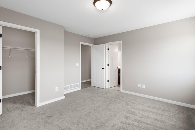 1003 Misty Meadow Blvd, Buffalo, MN 55313 - unfurnished bedroom featuring carpet, baseboards, a closet, and a spacious closet