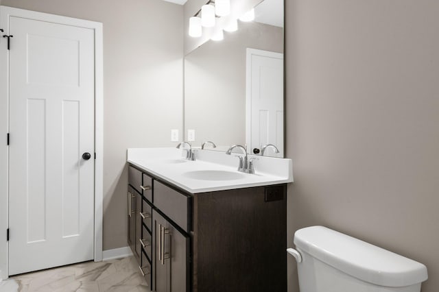 1003 Misty Meadow Blvd, Buffalo, MN 55313 - bathroom featuring marble finish flooring, double vanity, toilet, and baseboards