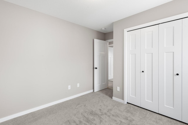 1003 Misty Meadow Blvd, Buffalo, MN 55313 - unfurnished bedroom featuring carpet floors, baseboards, and a closet