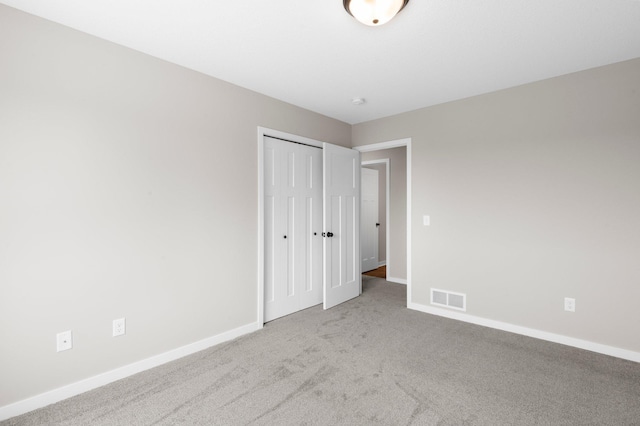 1003 Misty Meadow Blvd, Buffalo, MN 55313 - unfurnished bedroom with carpet flooring, baseboards, and a closet