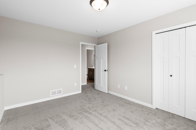 1003 Misty Meadow Blvd, Buffalo, MN 55313 - unfurnished bedroom with carpet flooring, baseboards, and a closet