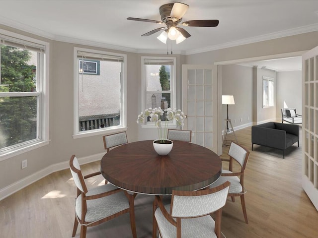 dining space featuring light wood-style floors, a wealth of natural light, and french doors