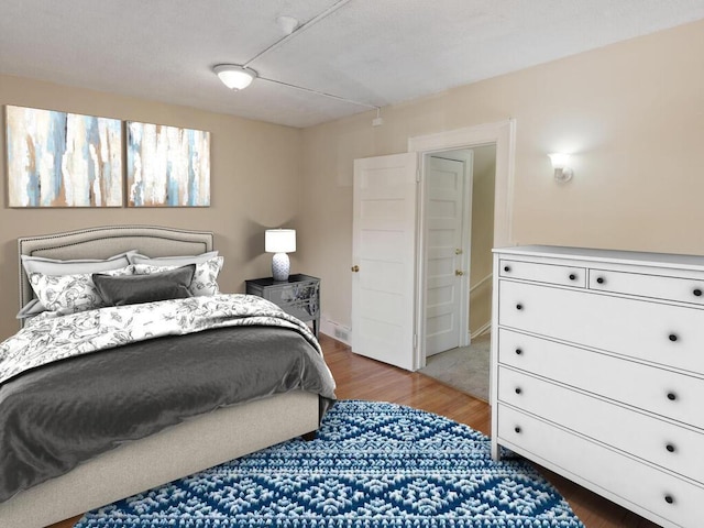 bedroom with wood finished floors