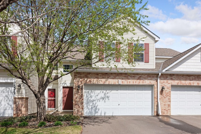 15374 Flower Way, Apple Valley, MN 55124 - view of front of property with aphalt driveway, a shingled roof, and brick siding