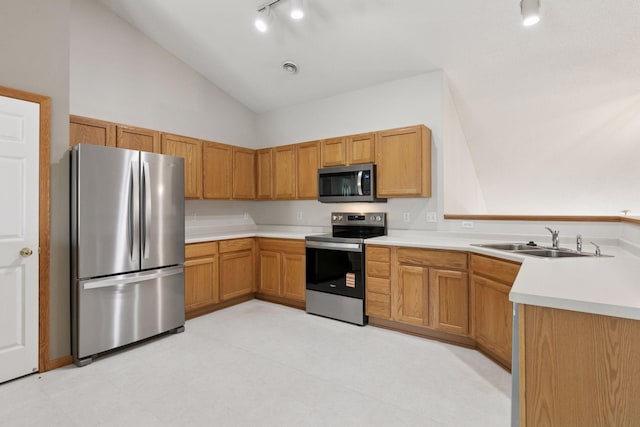 15374 Flower Way, Apple Valley, MN 55124 - kitchen with rail lighting, appliances with stainless steel finishes, light countertops, and a sink
