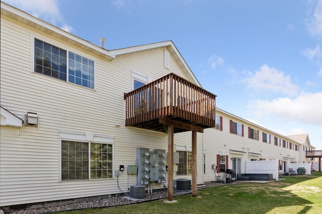 15374 Flower Way, Apple Valley, MN 55124 - back of property with a deck, central air condition unit, and a yard