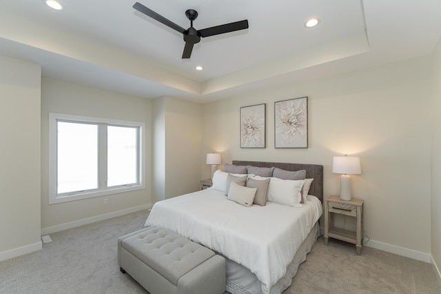 bedroom featuring light carpet, baseboards, and recessed lighting