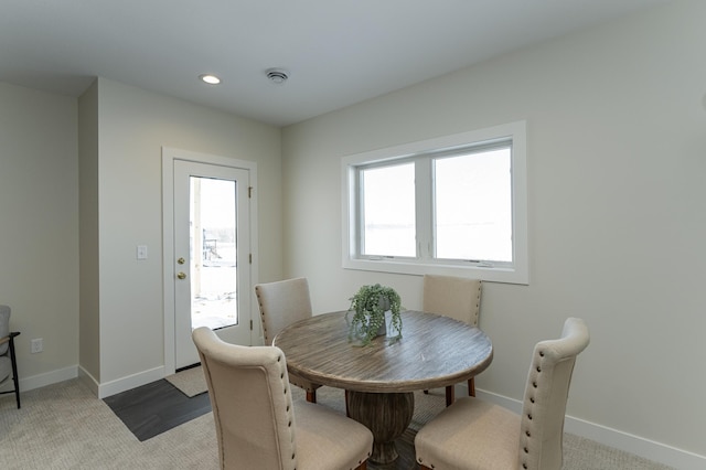 dining space featuring recessed lighting and baseboards