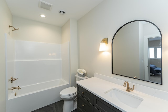 bathroom with visible vents, vanity, toilet, and bathing tub / shower combination