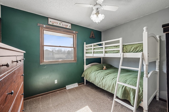 bedroom with a ceiling fan, baseboards, visible vents, a textured ceiling, and carpet flooring