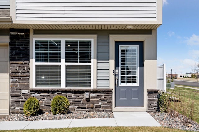 8730 Parkington Ave NE, Otsego, MN 55330 - entrance to property with stone siding and fence