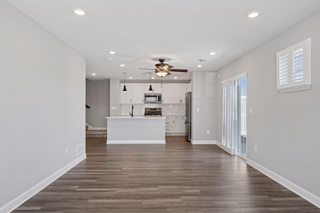 8730 Parkington Ave NE, Otsego, MN 55330 - unfurnished living room featuring baseboards, a ceiling fan, dark wood-style floors, and recessed lighting