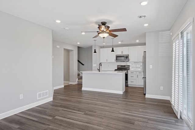 8730 Parkington Ave NE, Otsego, MN 55330 - kitchen featuring a healthy amount of sunlight, stainless steel appliances, visible vents, and a sink