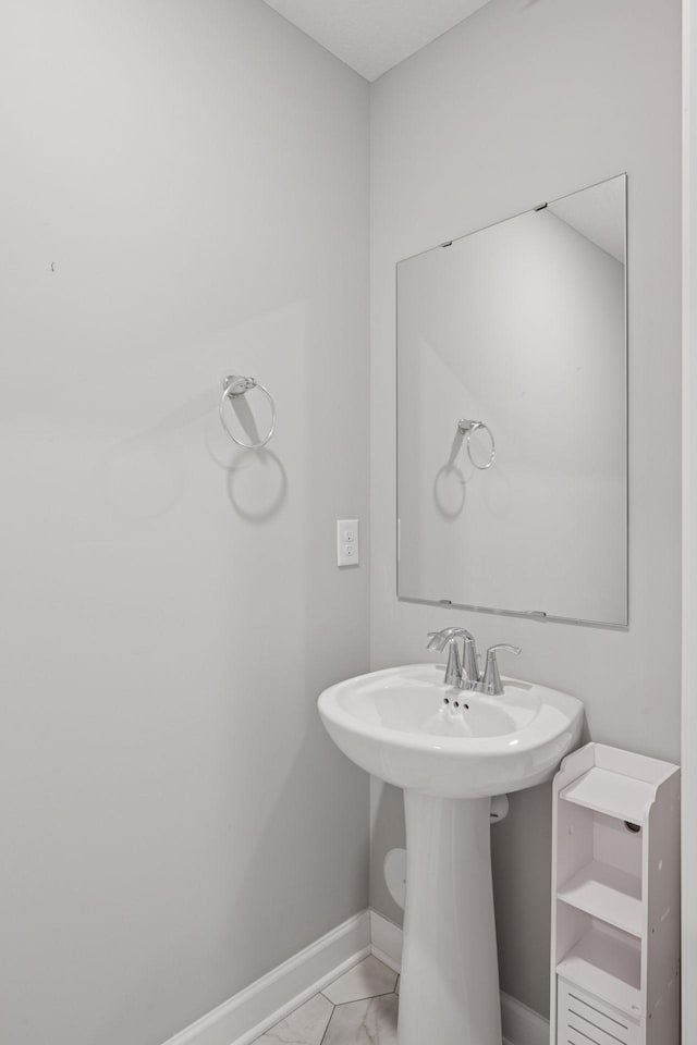 8730 Parkington Ave NE, Otsego, MN 55330 - bathroom featuring baseboards and marble finish floor