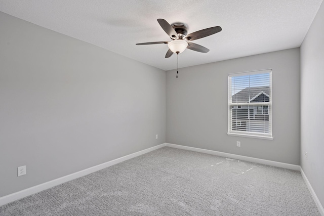 8730 Parkington Ave NE, Otsego, MN 55330 - unfurnished room featuring light colored carpet, ceiling fan, baseboards, and a textured ceiling