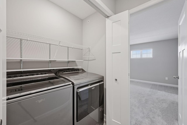 8730 Parkington Ave NE, Otsego, MN 55330 - washroom featuring separate washer and dryer, baseboards, carpet floors, and laundry area