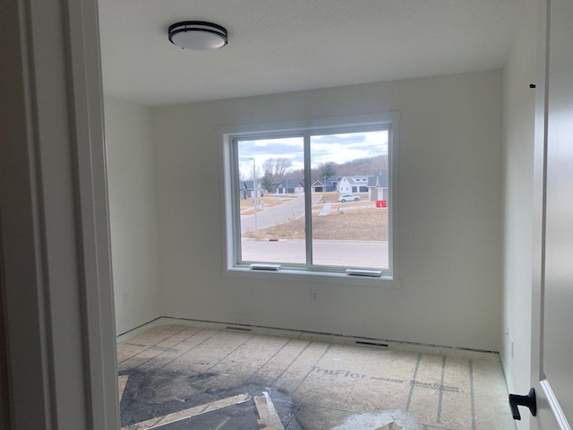 spare room featuring visible vents