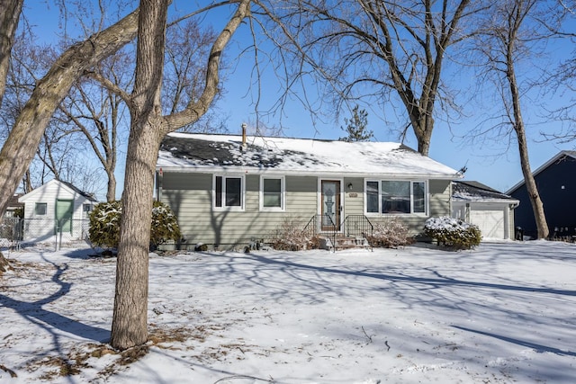 view of front of house featuring a garage and fence