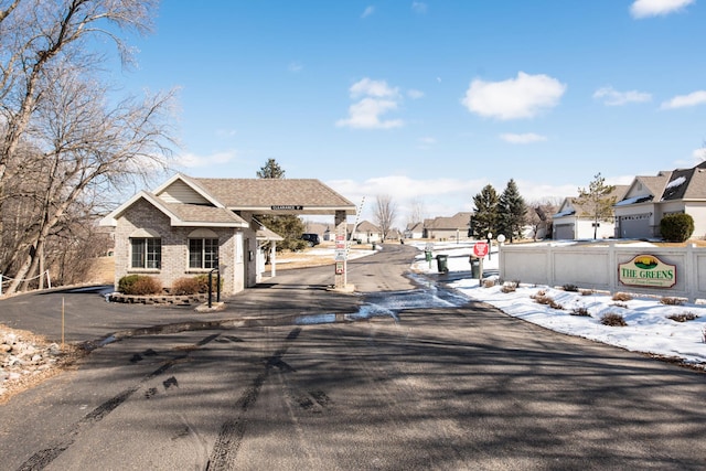 view of street featuring traffic signs and a residential view