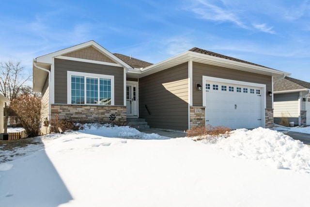 view of front of house with a garage and stone siding