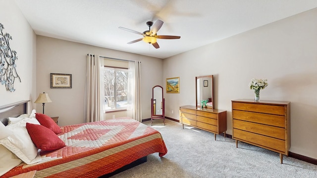 carpeted bedroom with baseboards and ceiling fan