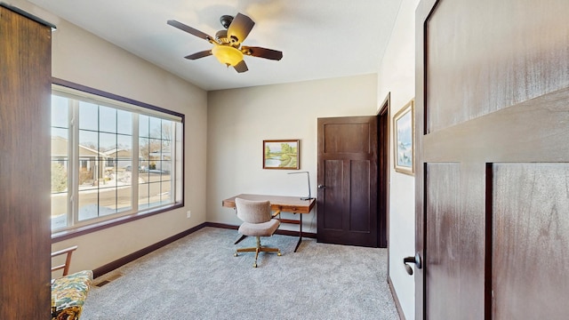 carpeted office with visible vents, ceiling fan, and baseboards