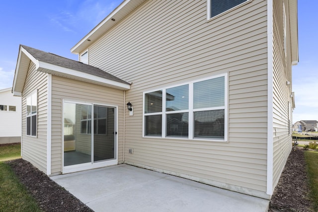 back of property featuring a patio area