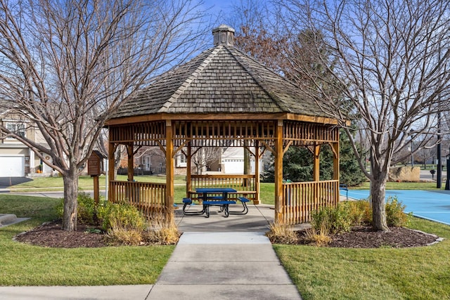 surrounding community featuring a gazebo and a lawn