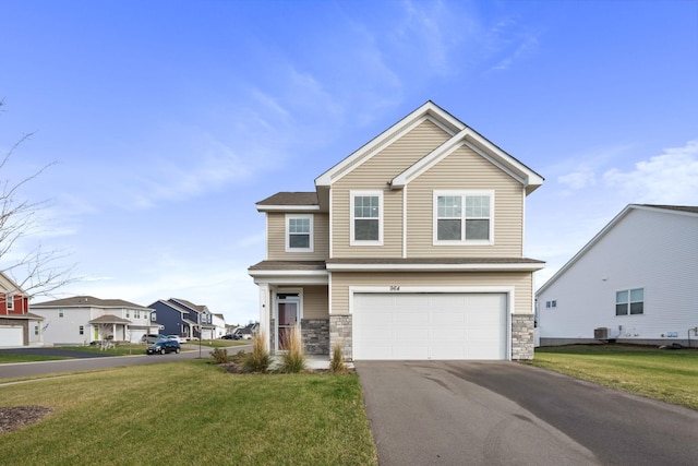 view of front of home with an attached garage, driveway, stone siding, and a front yard