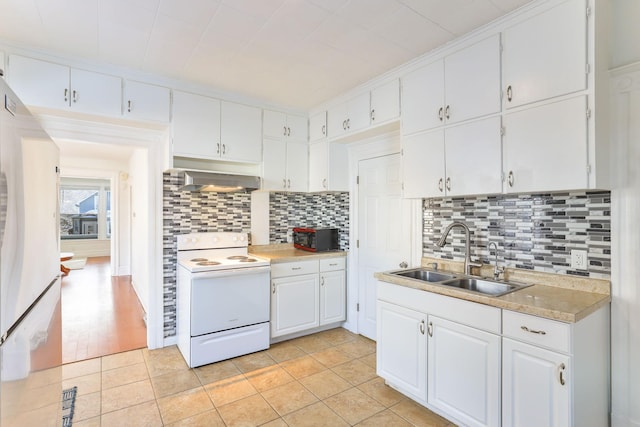 kitchen featuring white appliances, a sink, light countertops, white cabinetry, and exhaust hood