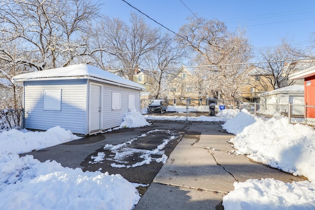 exterior space with an outdoor structure, fence, and a garage