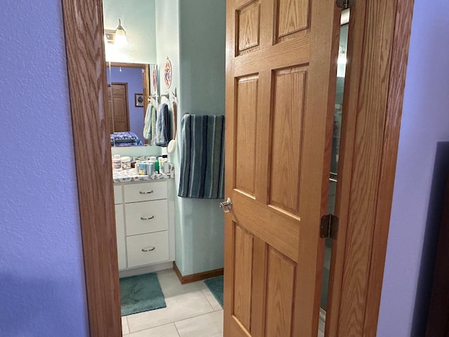 bathroom with tile patterned floors and vanity