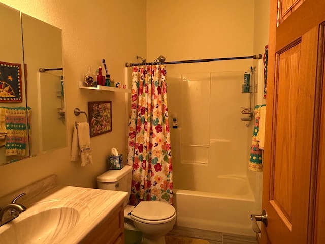 full bath featuring vanity, shower / bath combo with shower curtain, and toilet