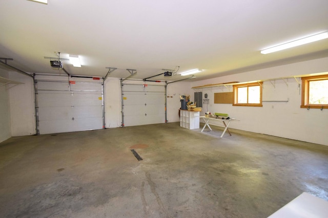 15633 Explorer Ln, Park Rapids, MN 56470 - garage featuring a garage door opener and electric panel