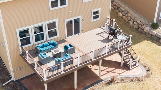 exterior space with a deck, an outdoor hangout area, and stairs