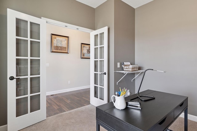 carpeted office with baseboards and french doors
